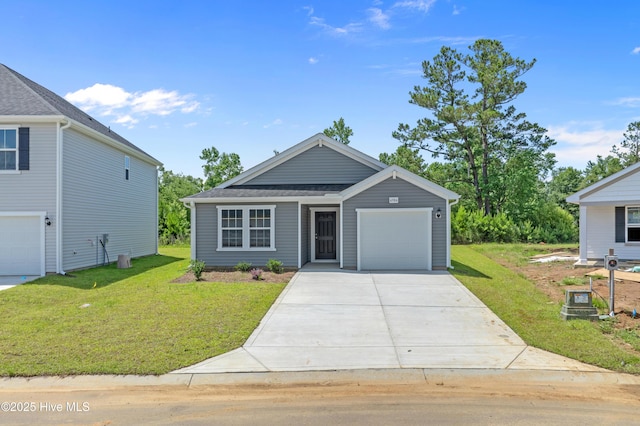 6986 Seaside Palms Pl SW, Sunset Beach, NC 28468 - view of front of property featuring concrete driveway, a front lawn, and an attached garage