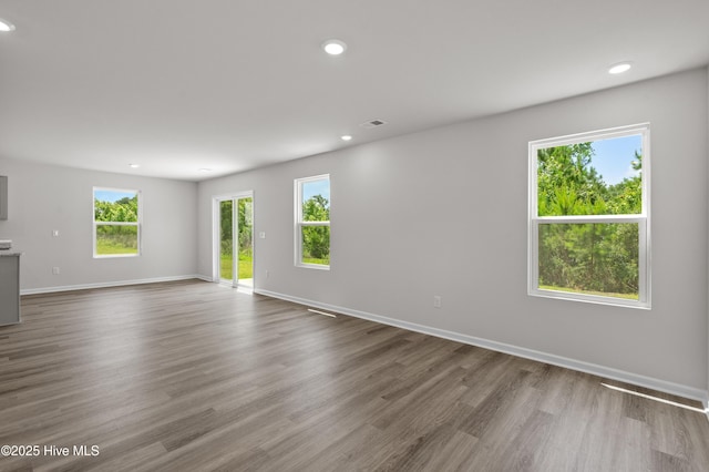 6986 Seaside Palms Pl SW, Sunset Beach, NC 28468 - empty room featuring wood finished floors and recessed lighting