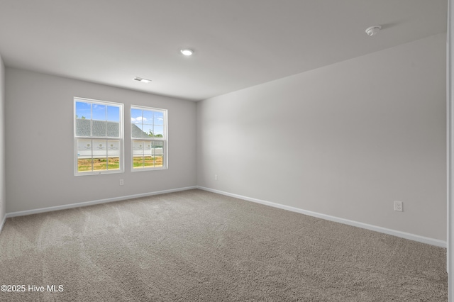 6986 Seaside Palms Pl SW, Sunset Beach, NC 28468 - carpeted empty room featuring baseboards and a smoke detector