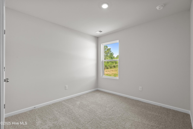 6986 Seaside Palms Pl SW, Sunset Beach, NC 28468 - unfurnished room with carpet flooring and a smoke detector