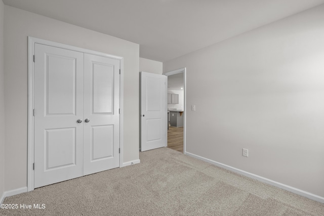 6986 Seaside Palms Pl SW, Sunset Beach, NC 28468 - unfurnished bedroom featuring carpet and a closet