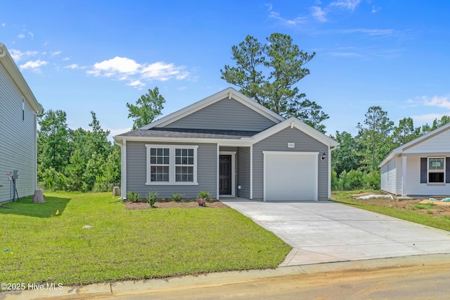 6986 Seaside Palms Pl SW, Sunset Beach, NC 28468 - view of front facade featuring an attached garage, a front lawn, and driveway