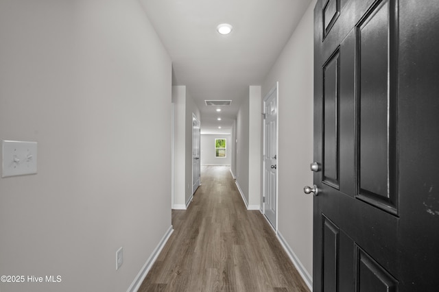 6986 Seaside Palms Pl SW, Sunset Beach, NC 28468 - hall featuring wood finished floors and recessed lighting