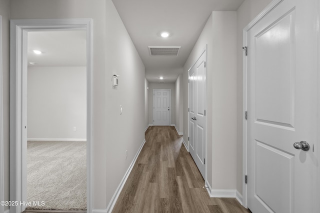6986 Seaside Palms Pl SW, Sunset Beach, NC 28468 - hallway featuring wood finished floors and recessed lighting