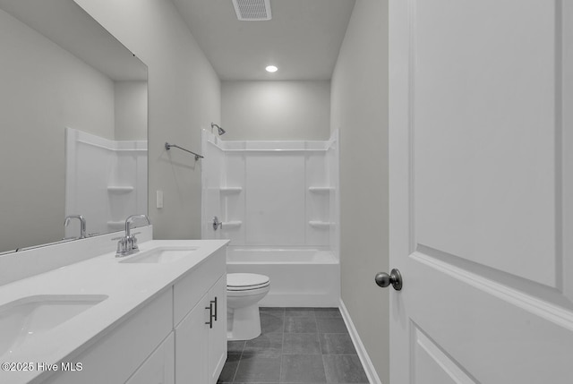 full bathroom featuring vanity, bathing tub / shower combination, and toilet