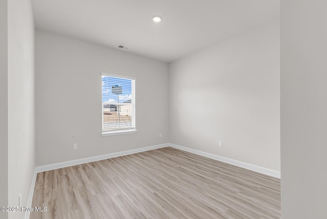 unfurnished room with light hardwood / wood-style flooring