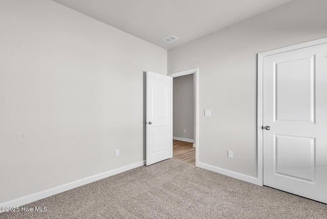 unfurnished bedroom with carpet flooring