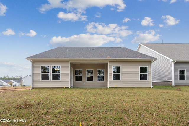 back of house featuring a yard