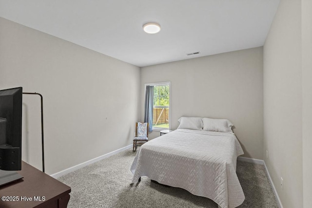 bedroom with visible vents, carpet flooring, and baseboards