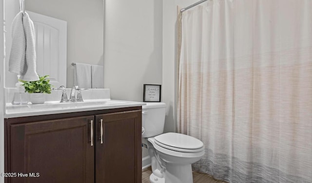 311 Mckenzie Pl, Sneads Ferry, NC 28460 - bathroom with toilet, vanity, and a shower with shower curtain