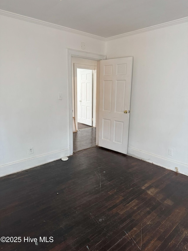 unfurnished room featuring crown molding and dark hardwood / wood-style floors