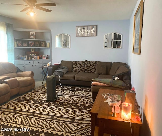 living area with ceiling fan