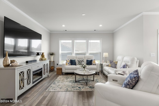 living room with ornamental molding and wood-type flooring