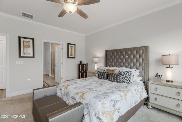 carpeted bedroom featuring crown molding and ceiling fan