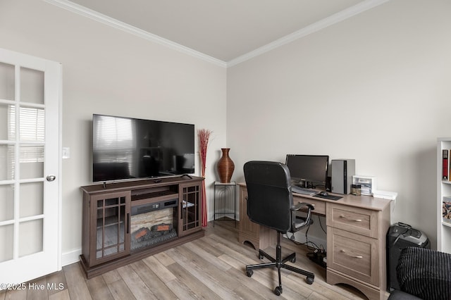 office space featuring ornamental molding and light hardwood / wood-style flooring