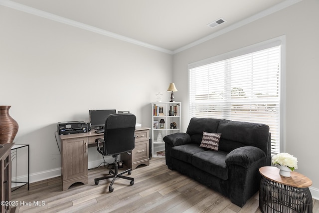 office with ornamental molding and light wood-type flooring