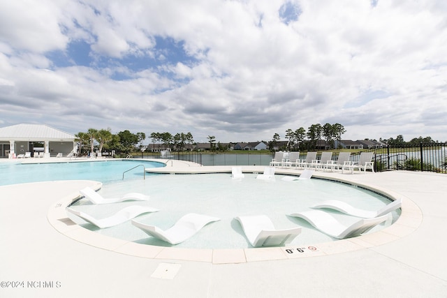 view of swimming pool featuring a patio area