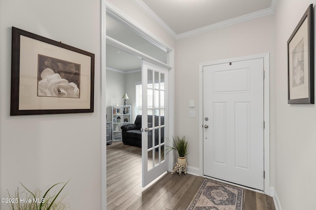 entrance foyer featuring crown molding, hardwood / wood-style floors, and french doors