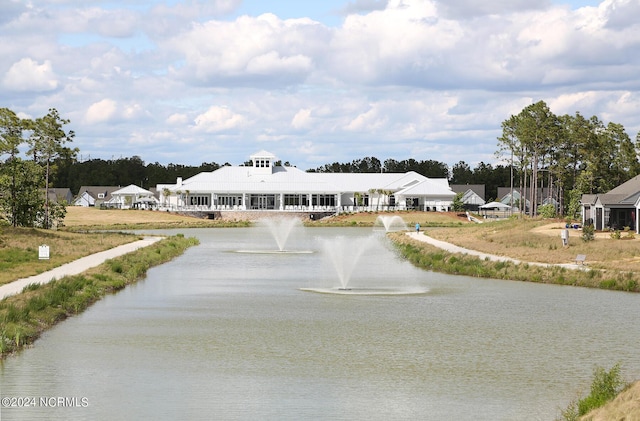 view of front facade with a water view