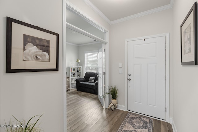 entryway with crown molding and hardwood / wood-style flooring