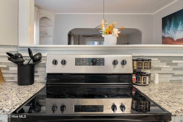 details with crown molding, light stone countertops, stainless steel electric range, and backsplash