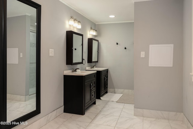 bathroom with ornamental molding and vanity