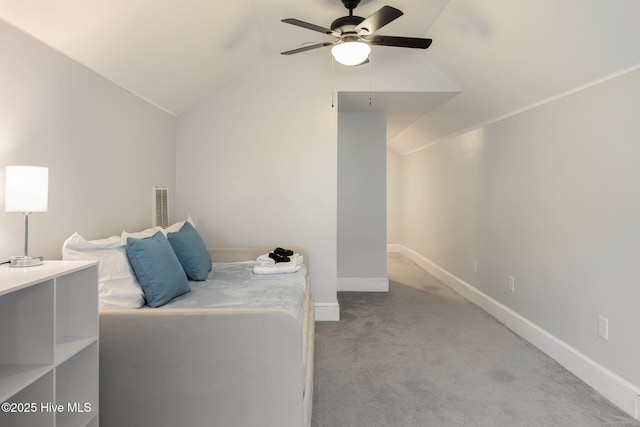 unfurnished bedroom featuring lofted ceiling, light carpet, and ceiling fan