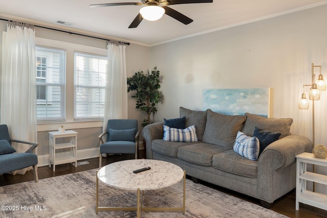 living room with ornamental molding, ceiling fan, and dark hardwood / wood-style flooring