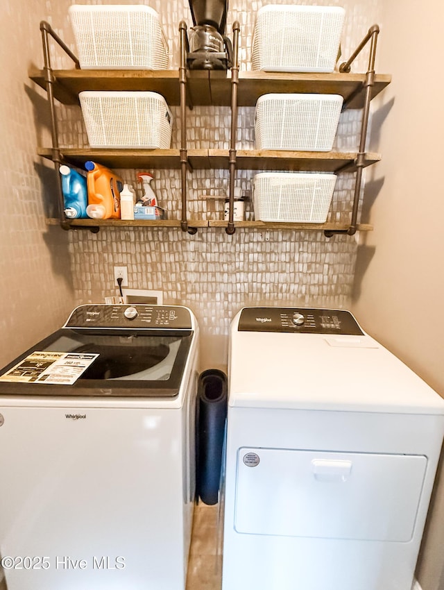 washroom with washer and dryer