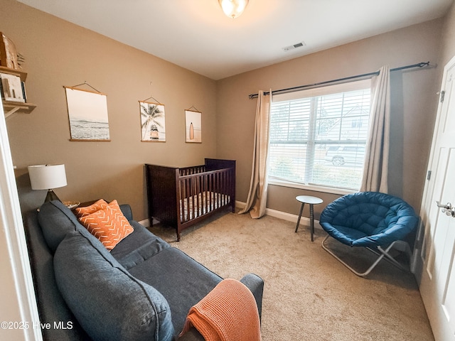 bedroom featuring light colored carpet