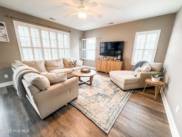 living room with hardwood / wood-style floors and ceiling fan