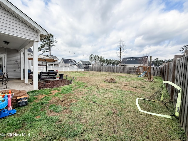 view of yard featuring a patio area and a playground