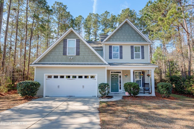 craftsman house featuring board and batten siding, concrete driveway, a garage, and covered porch