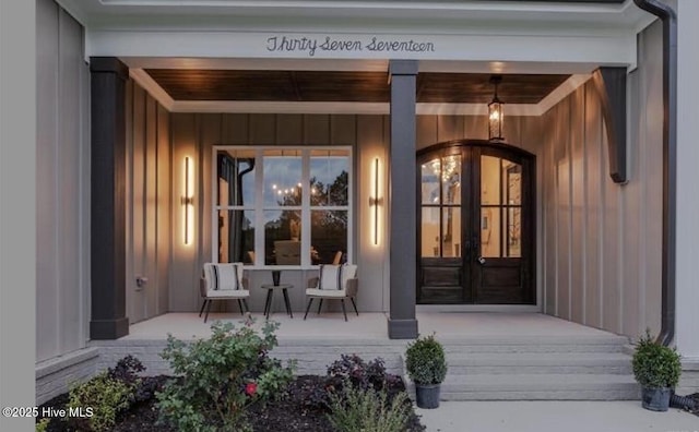 entrance to property featuring covered porch