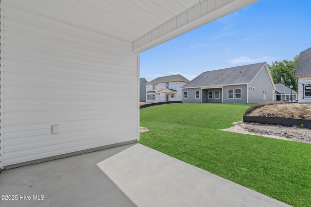 1204 Calabash Station Blvd NW, Calabash, NC 28467 - view of green lawn featuring a patio area and a residential view