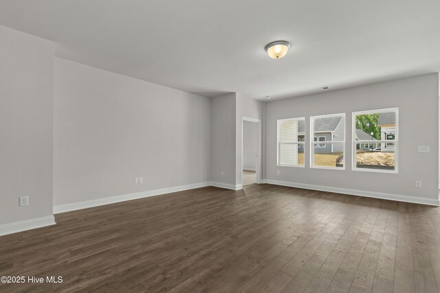 1204 Calabash Station Blvd NW, Calabash, NC 28467 - unfurnished room featuring dark wood-type flooring and baseboards