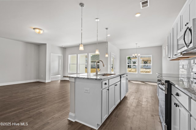 1204 Calabash Station Blvd NW, Calabash, NC 28467 - kitchen with a sink, stainless steel appliances, dark wood finished floors, a chandelier, and recessed lighting