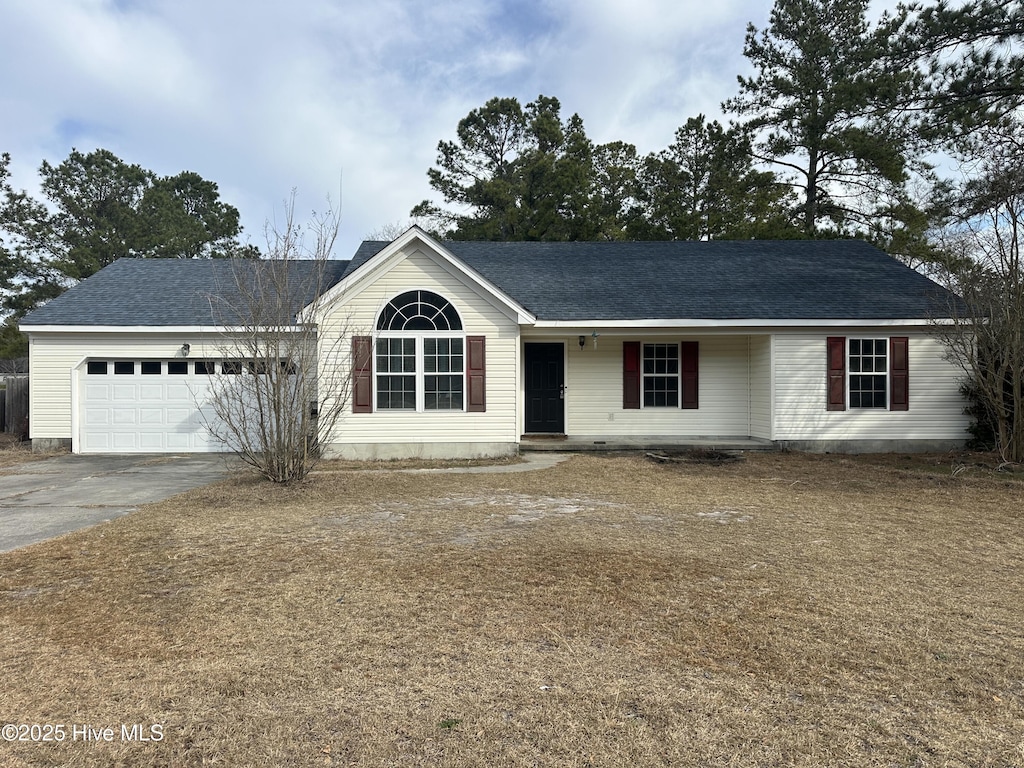 ranch-style house featuring a garage, concrete driveway, and roof with shingles