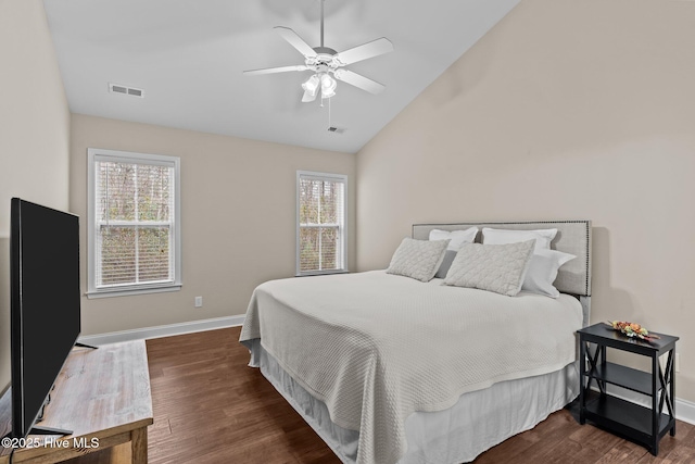 bedroom featuring lofted ceiling, dark wood-type flooring, and ceiling fan