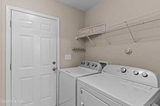 laundry area with washing machine and clothes dryer