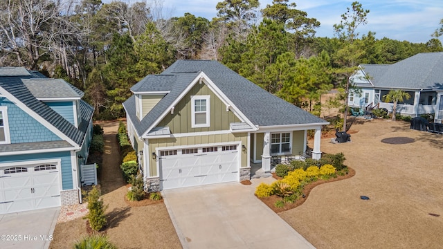 craftsman house with a garage and a porch