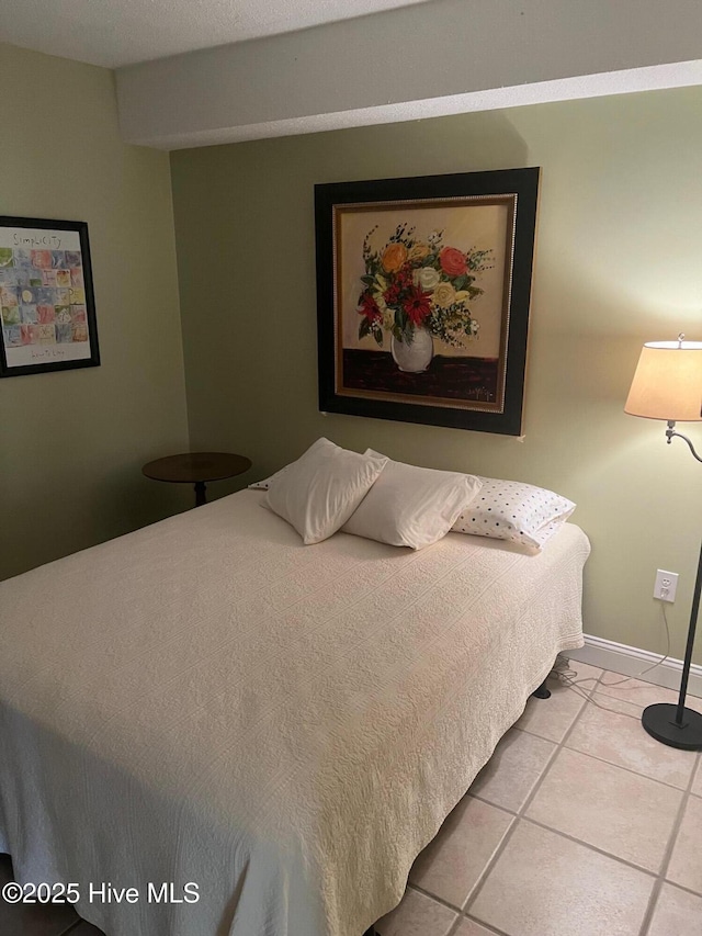 tiled bedroom with baseboards