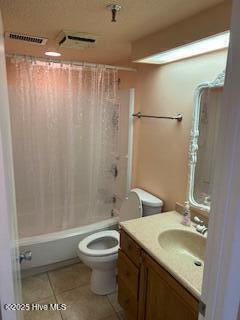 bathroom featuring shower / tub combo, visible vents, toilet, tile patterned floors, and vanity