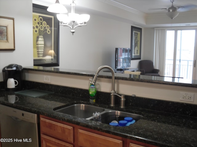 kitchen with dishwashing machine, sink, crown molding, dark stone countertops, and decorative light fixtures