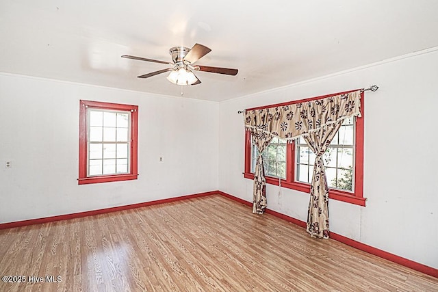 unfurnished room with ceiling fan and light hardwood / wood-style flooring