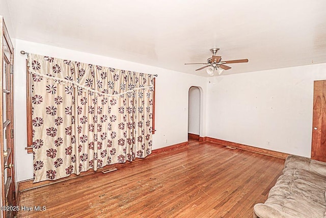 unfurnished living room with hardwood / wood-style flooring and ceiling fan