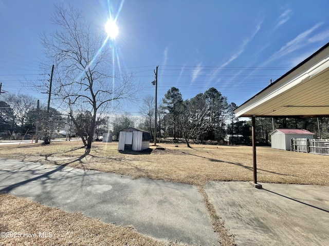 view of yard with a storage shed