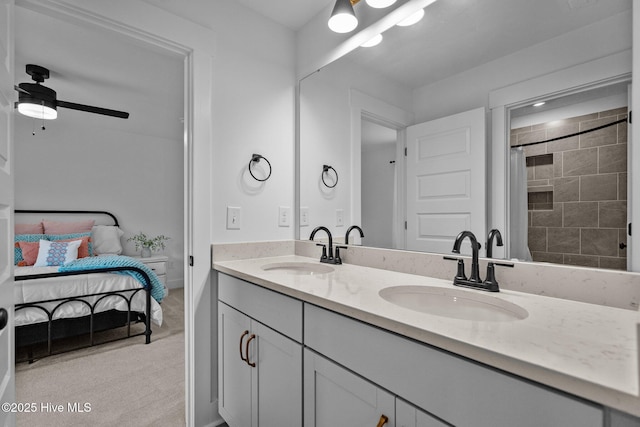 bathroom featuring vanity, ceiling fan, and walk in shower