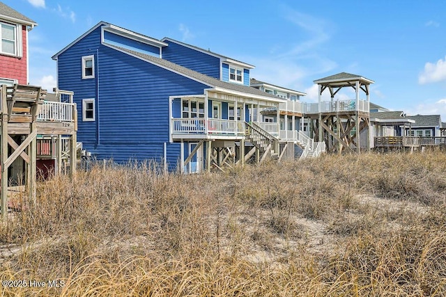 rear view of house with stairs