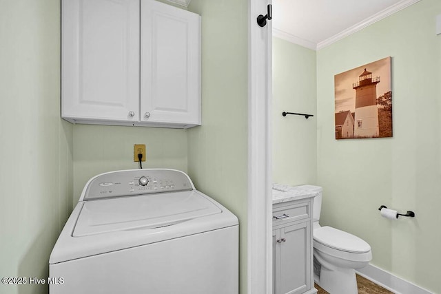 clothes washing area featuring washer / clothes dryer, baseboards, and ornamental molding